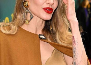 Angelina Jolie Channels Maria Callas In A Flower Brooch, Faux Fur Stole at Venice Film Festival
