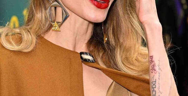Angelina Jolie Channels Maria Callas In A Flower Brooch, Faux Fur Stole at Venice Film Festival