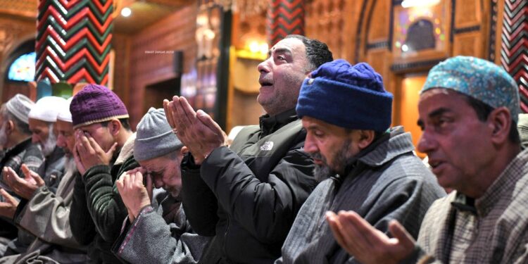 People recite the holy quran inside the shrine during the holy month of Ramadan in Srinagar