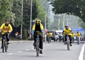 Participants took part in the ‘Pedal Through Paradise’ cycle race, organized by J&K Police on the banks of Dal Lake in Srinagar.