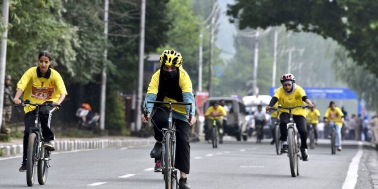 Participants took part in the ‘Pedal Through Paradise’ cycle race, organized by J&K Police on the banks of Dal Lake in Srinagar.